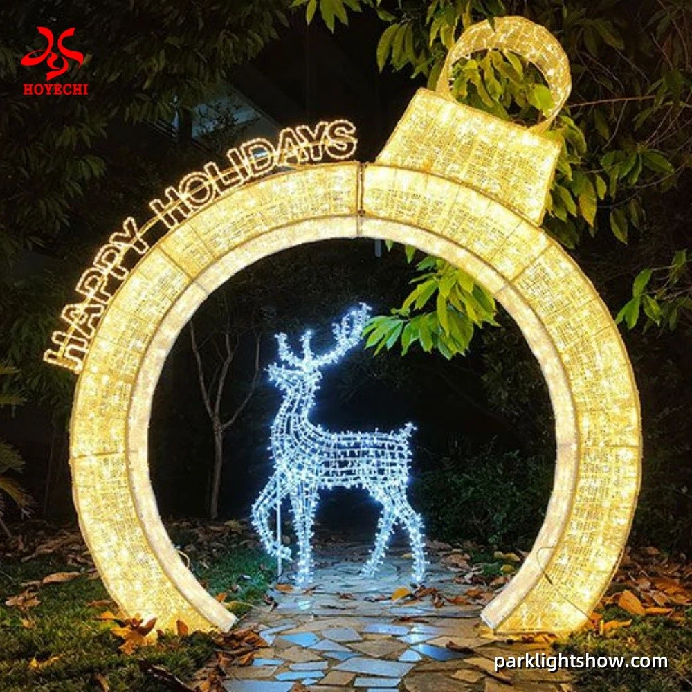 Large 3-meter Christmas ornament arch light decorated with waterproof LED string lights and PVC tinsel, designed by HOYECHI for parks and commercial festive installations Large 3-meter Christmas ornament arch light decorated with waterproof LED string lights and PVC tinsel, designed by HOYECHI for parks and commercial festive installations